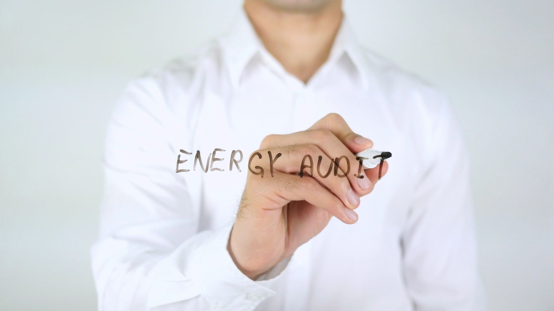 Energy Audit, Man Writing on Glass